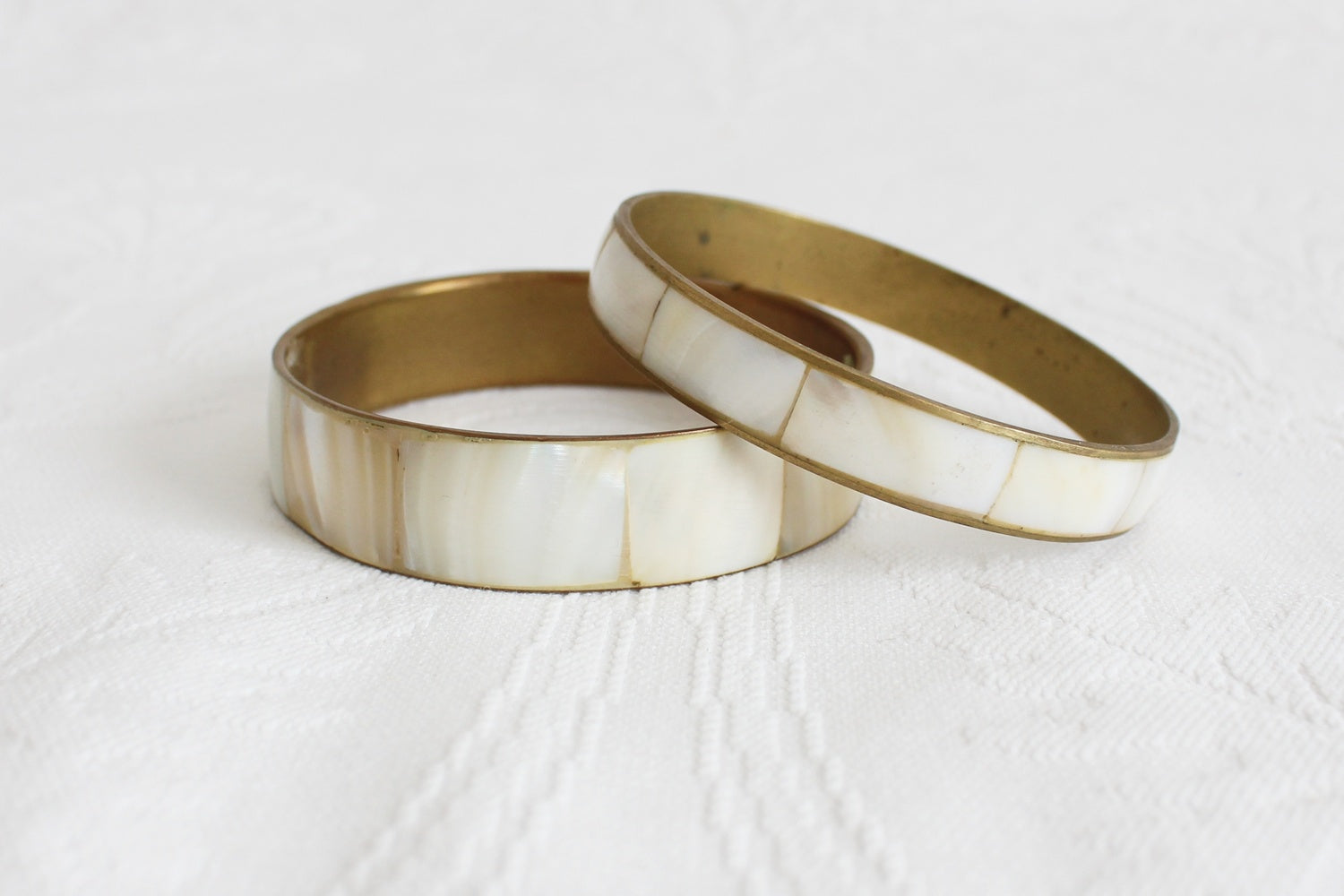 PAIR OF VINTAGE MOTHER OF PEARL BRASS BANGLES